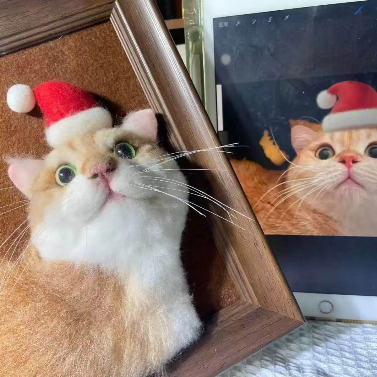 Custom framed plush pet portrait of a cat wearing Christmas hat in brown wood frame by Paw-Pixie
